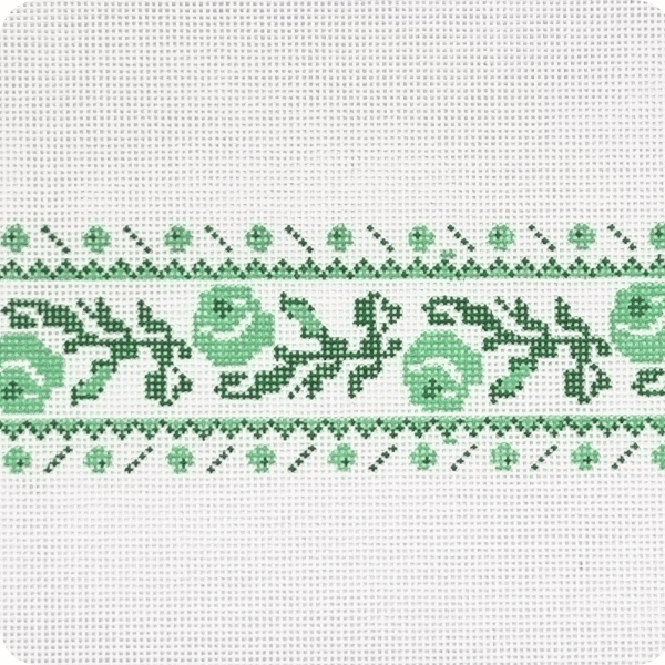 green floral needlepoint pattern with green leaves and flowers on a white background